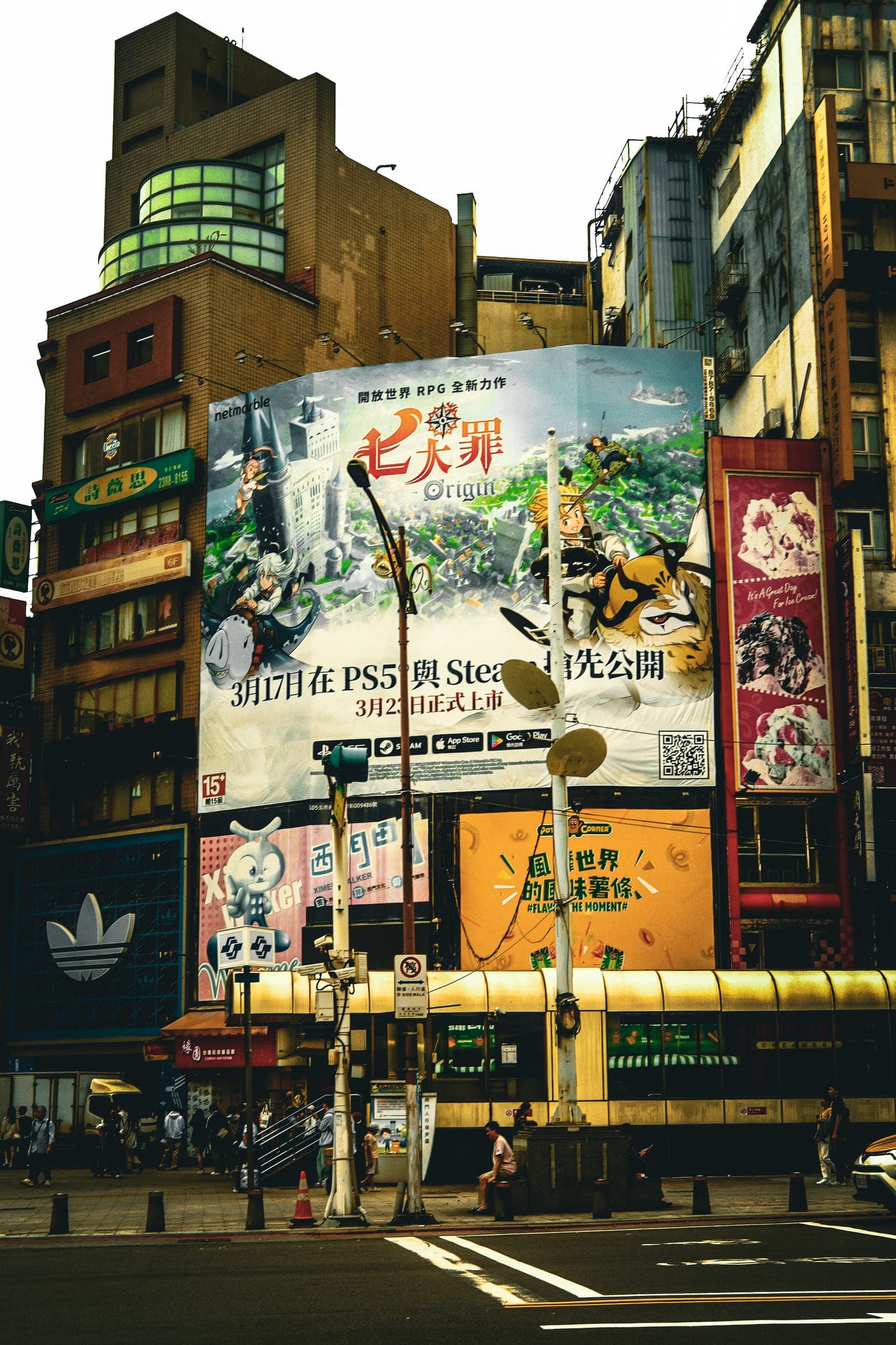 A large game-release billboard on a Ximending facade.